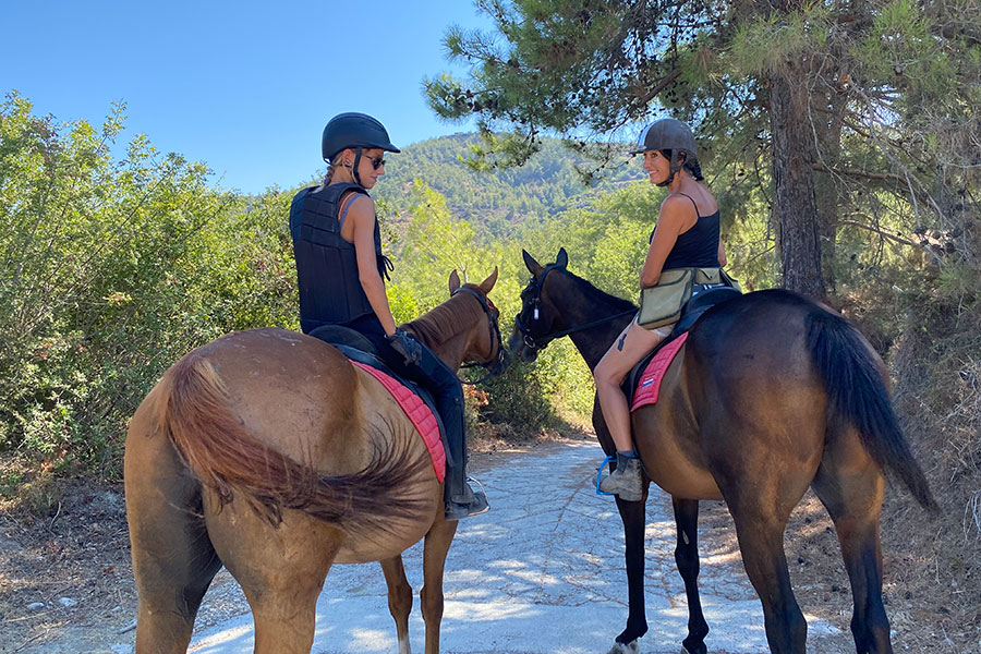 Photo of horse trekking with Debbie Maria (right)