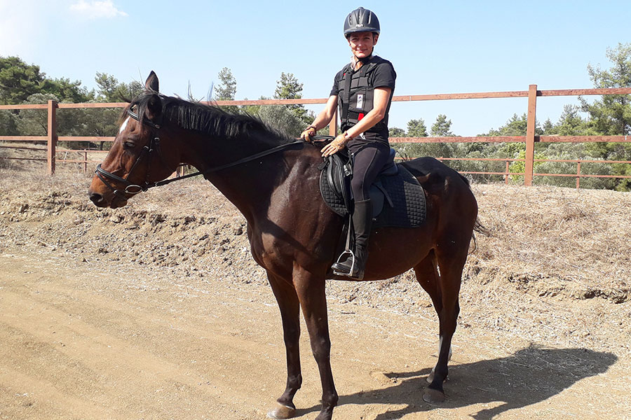 Photo of people riding horses
