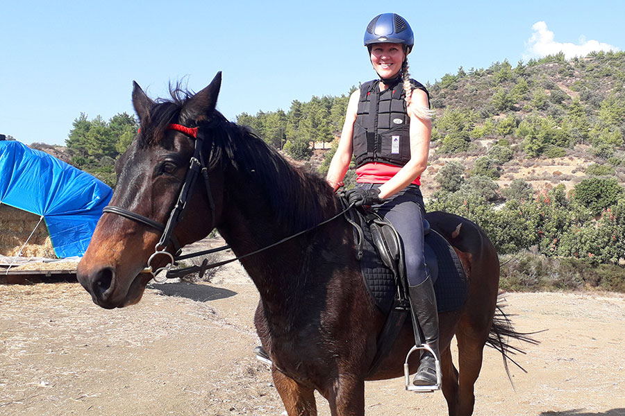 Photo of people riding horses