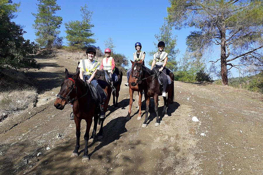Photo of people riding horses