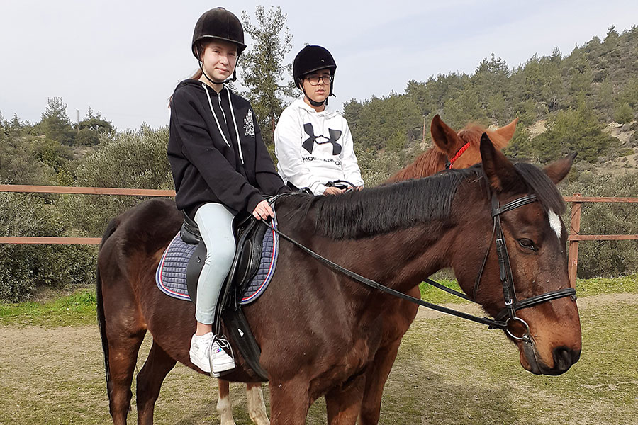 Photo of people riding horses