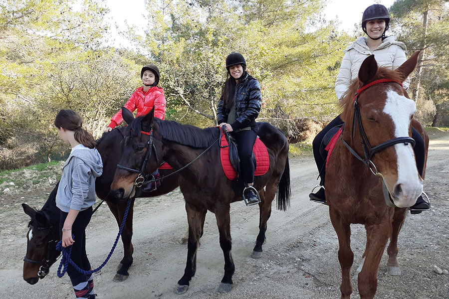 Photo of people riding horses
