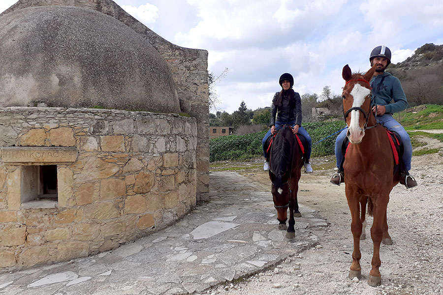 Photo of people riding horses