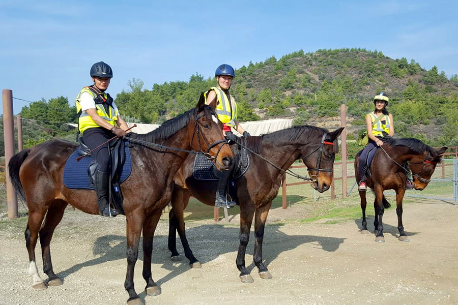 Photo of people riding horses
