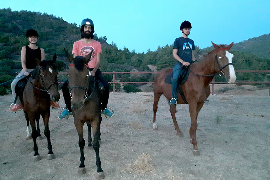 Photo of people riding horses