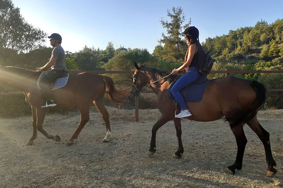 Photo of people riding horses