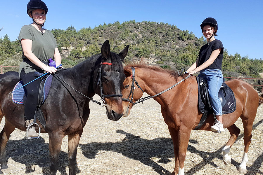 Photo of people riding horses