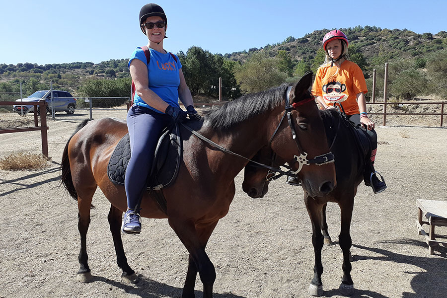 Photo of people riding horses