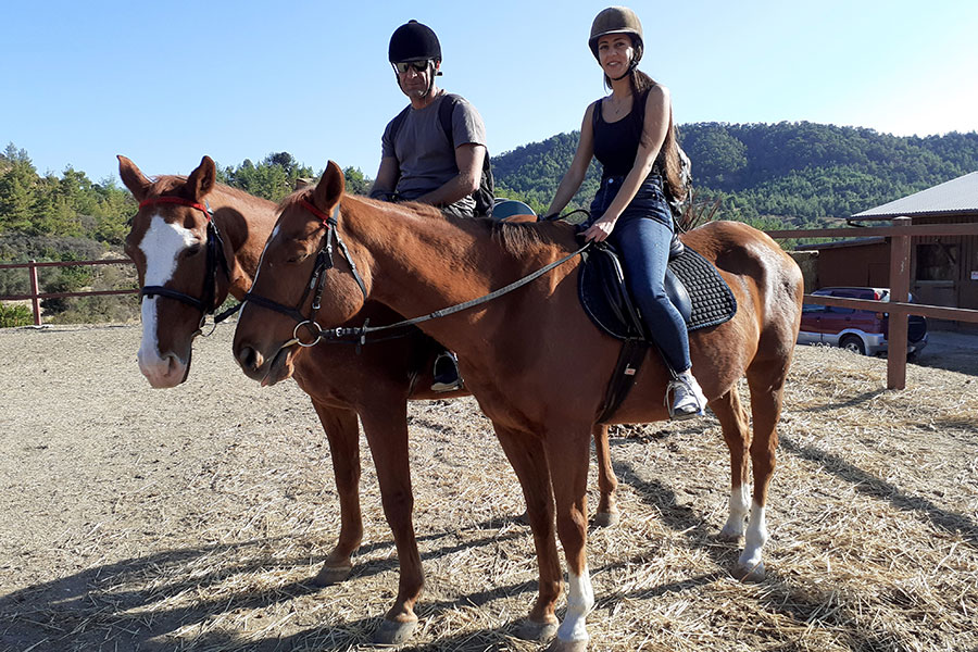 Photo of people riding horses
